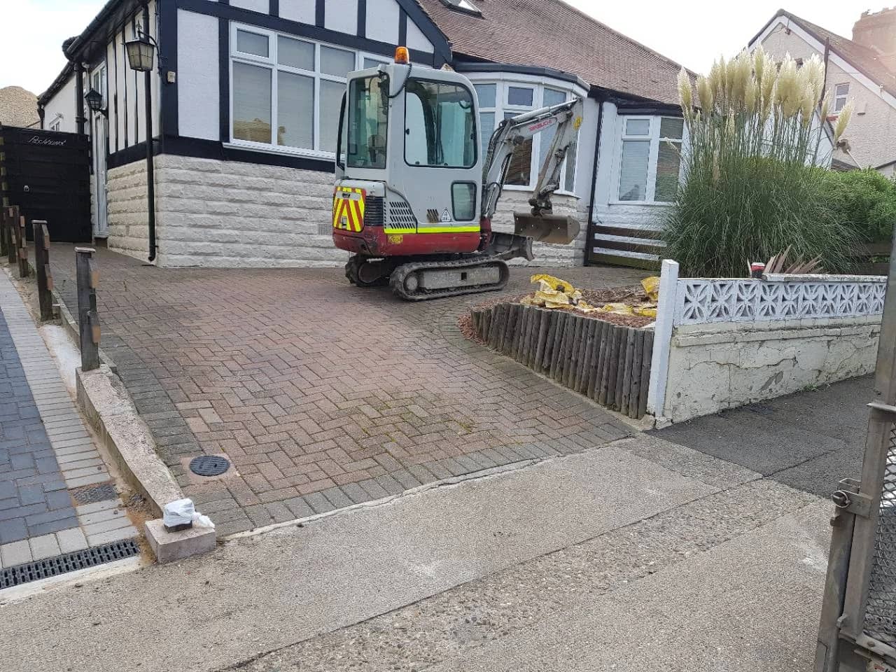 Before photo of the original block paving driveway in Taunton before Slate Grey block paving replacement work