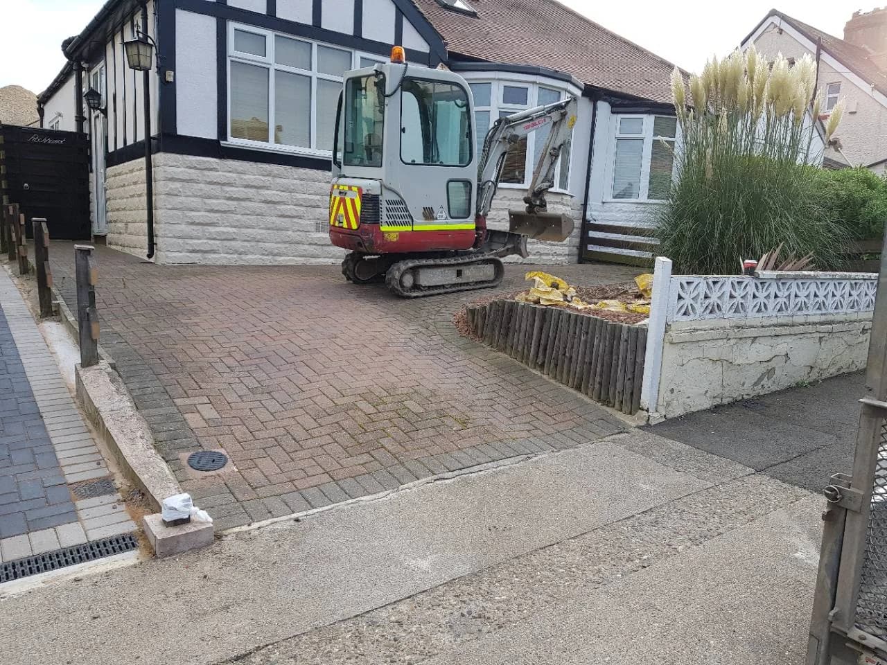 Before photo of the original block paving driveway in Taunton before Slate Grey block paving replacement work