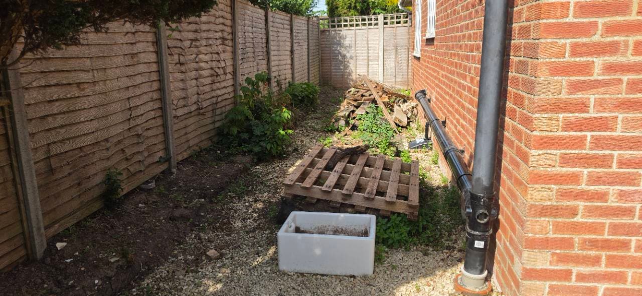 Side garden area before clearance for a resin patio extension in Bridgwater