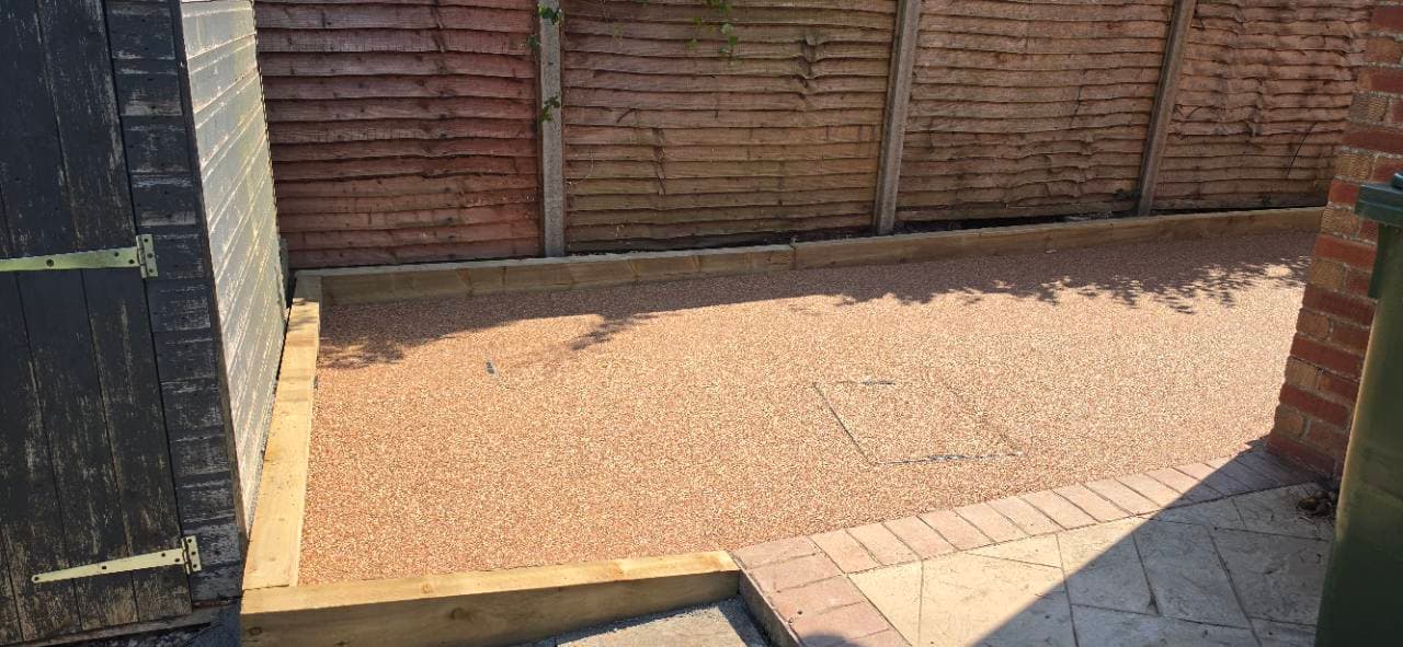 Finished Canyon Stone resin patio extension in Bridgwater with recessed service cover