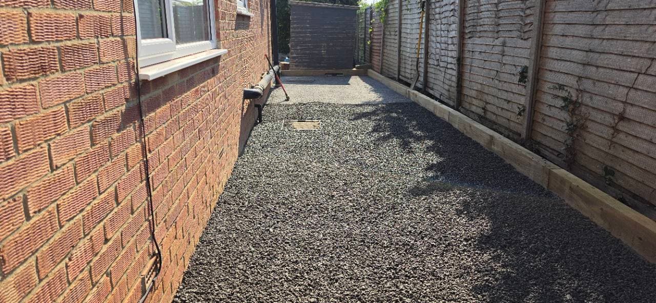 Long run of prepared base beside the house on the Bridgwater resin patio project