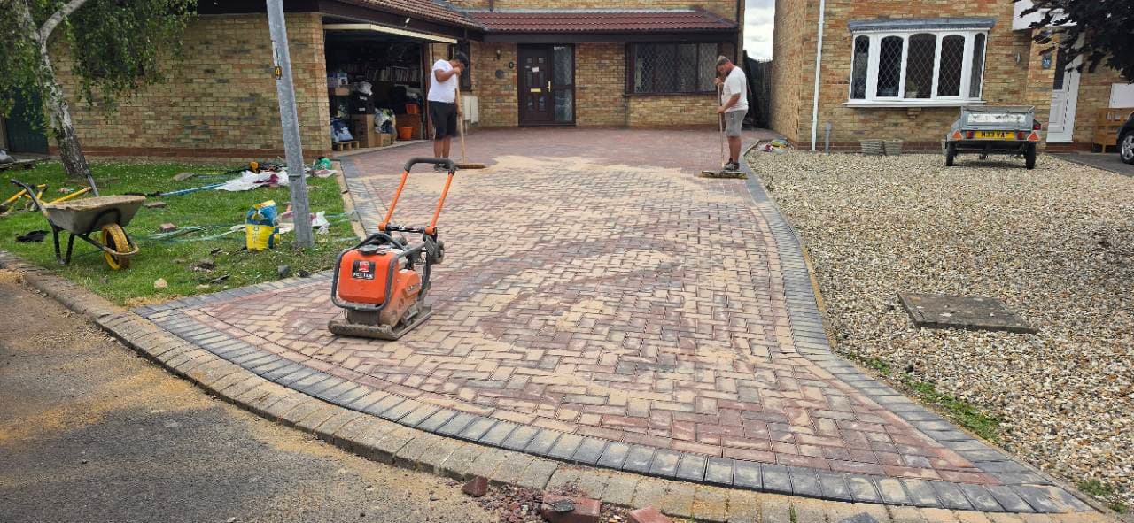 Final compaction of Brett brindle block paving driveway in Bristol