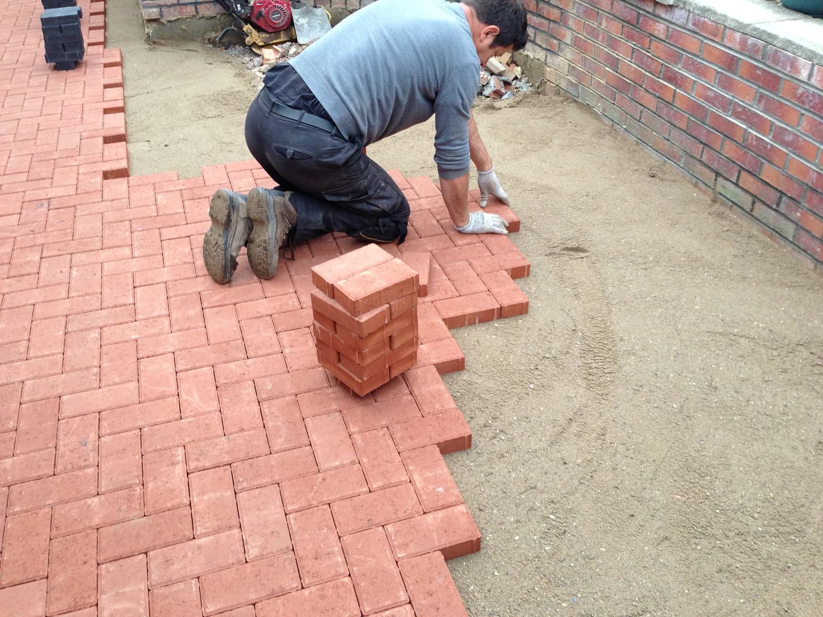 Straight block paving course lines being laid on the Burnham-on-Sea patio