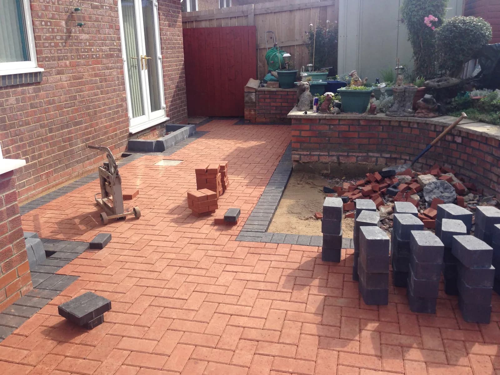 Block paving patio progress around the raised steps in Burnham-on-Sea