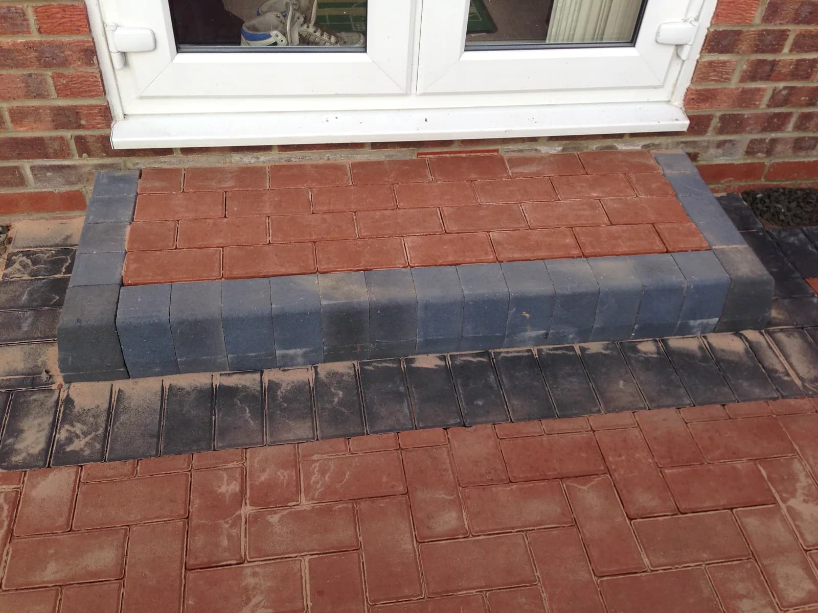 Finished door step border detail on a block paving patio in Burnham-on-Sea