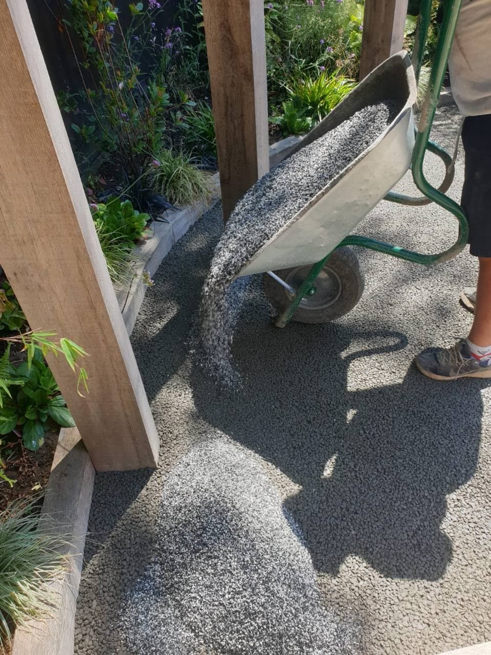 New Palazzo resin bound aggregate being barrowed onto the patio in Burnham-on-Sea