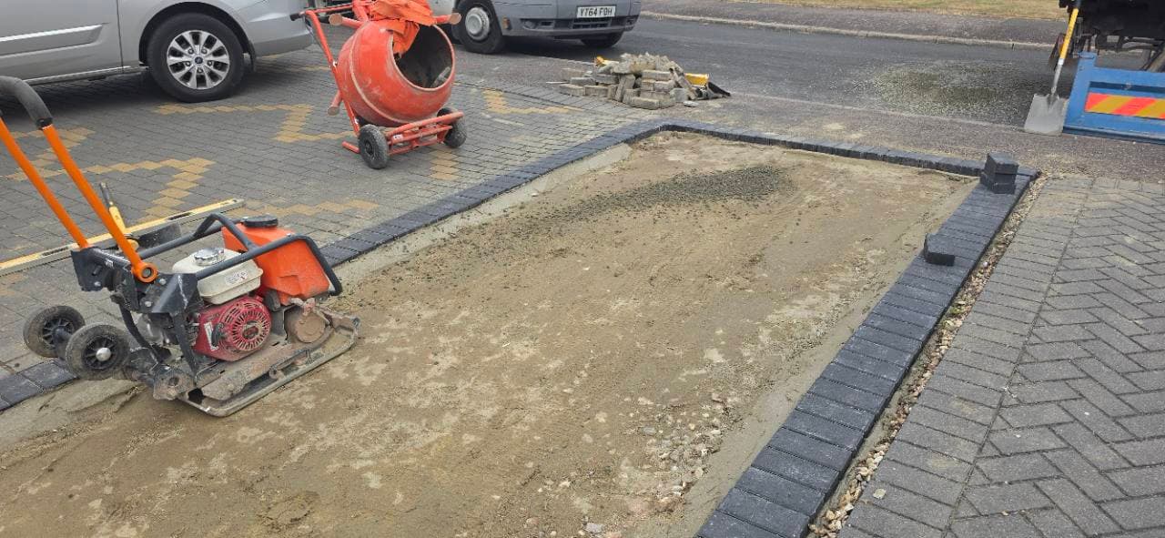 Concrete base and block paving edges prepared ready for resin bound in Exminster