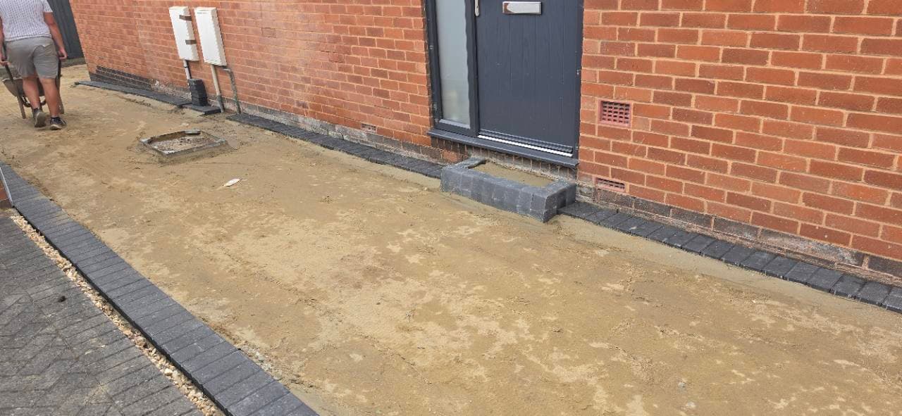 New block step and charcoal edge detail on the Exminster Palazzo resin driveway preparation
