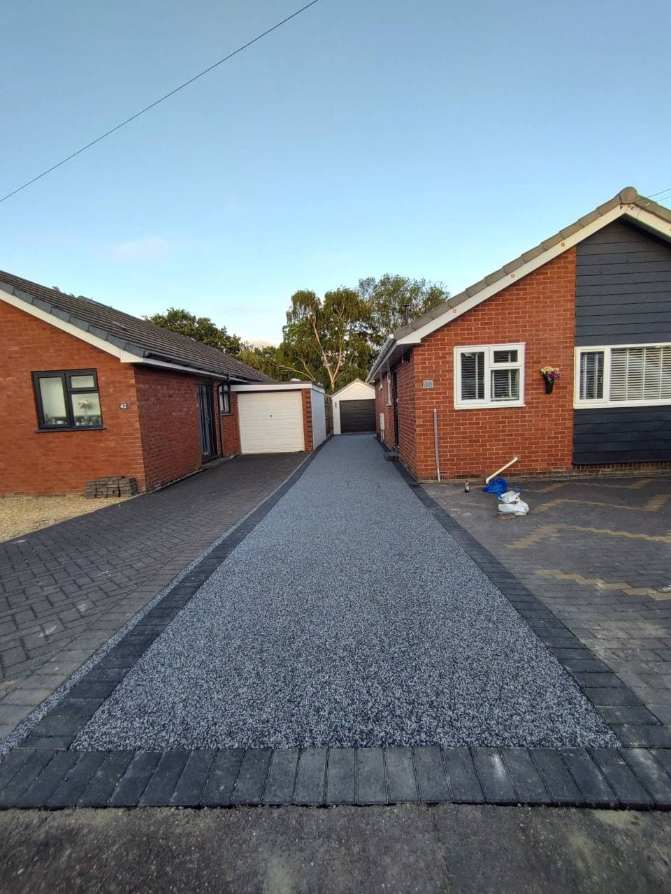 Completed Exminster Palazzo resin bound driveway with charcoal block borders