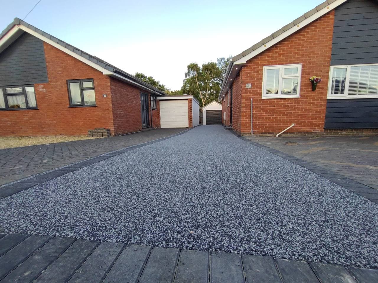 Low view of the completed Palazzo resin bound driveway and charcoal block edge