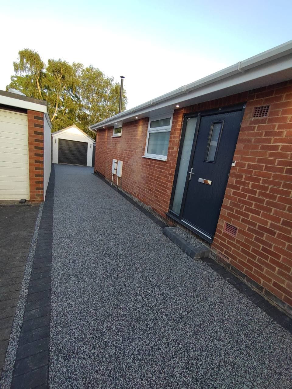 Completed Palazzo resin bound side access and doorstep step in Exminster