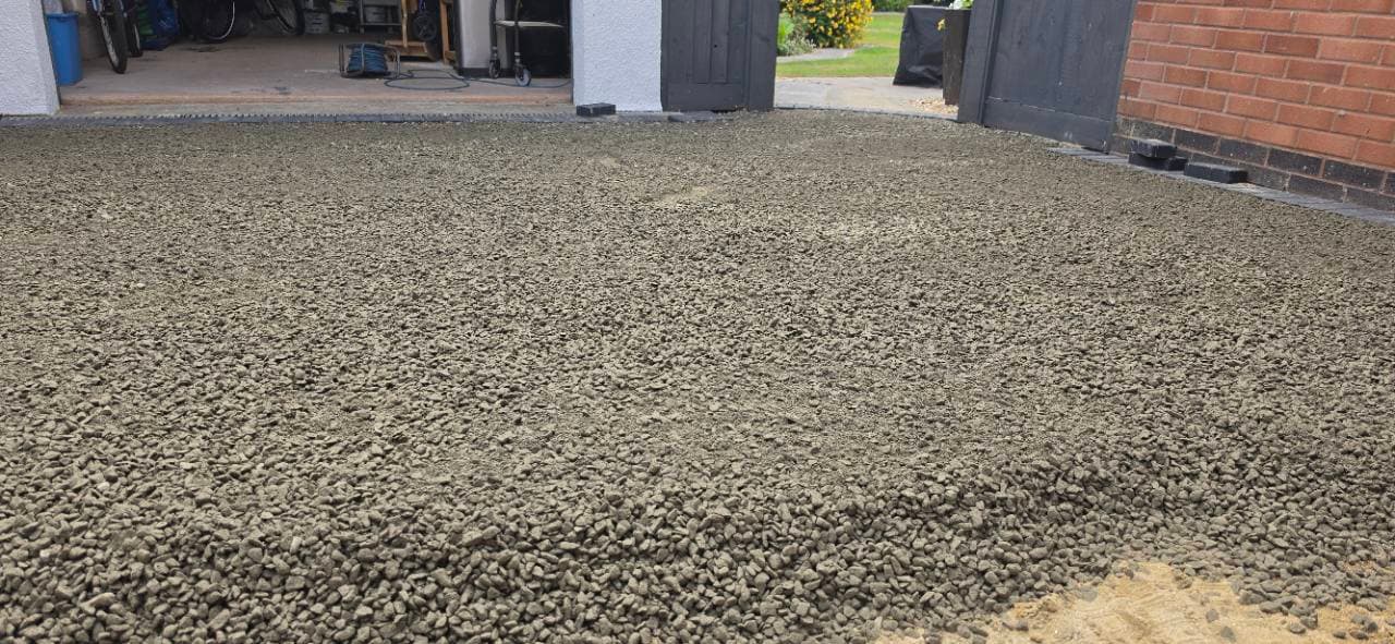 Close-up of the prepared concrete base texture before resin bound installation in Exminster