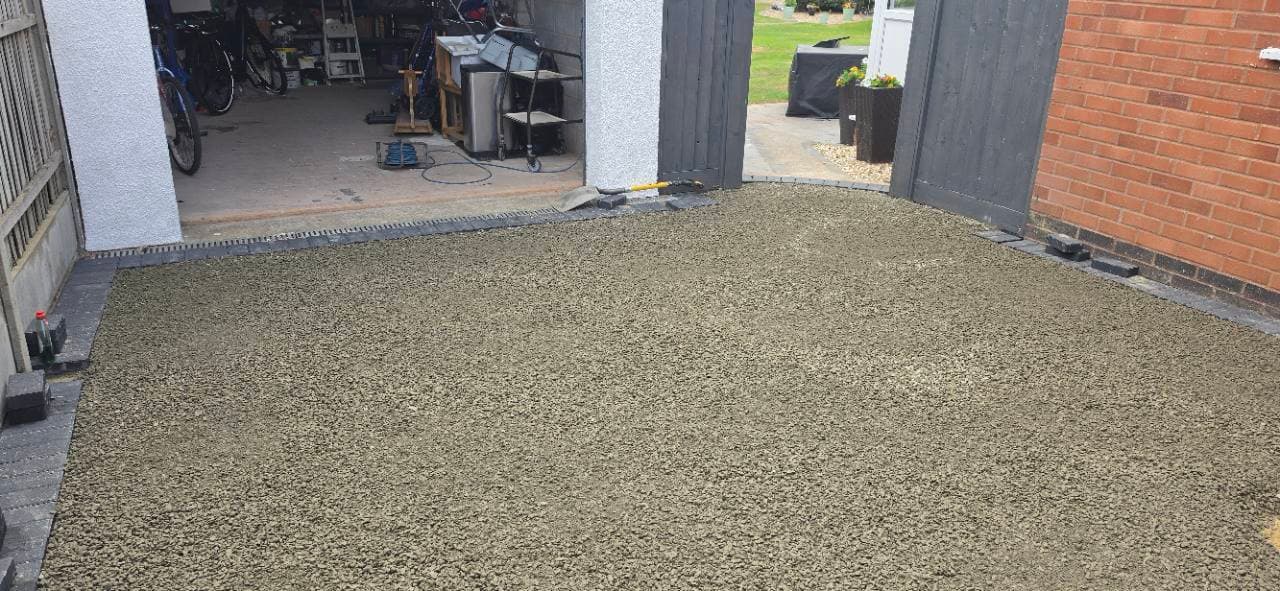 Concrete base laid through the Exminster garage access ready for the Palazzo resin bound finish