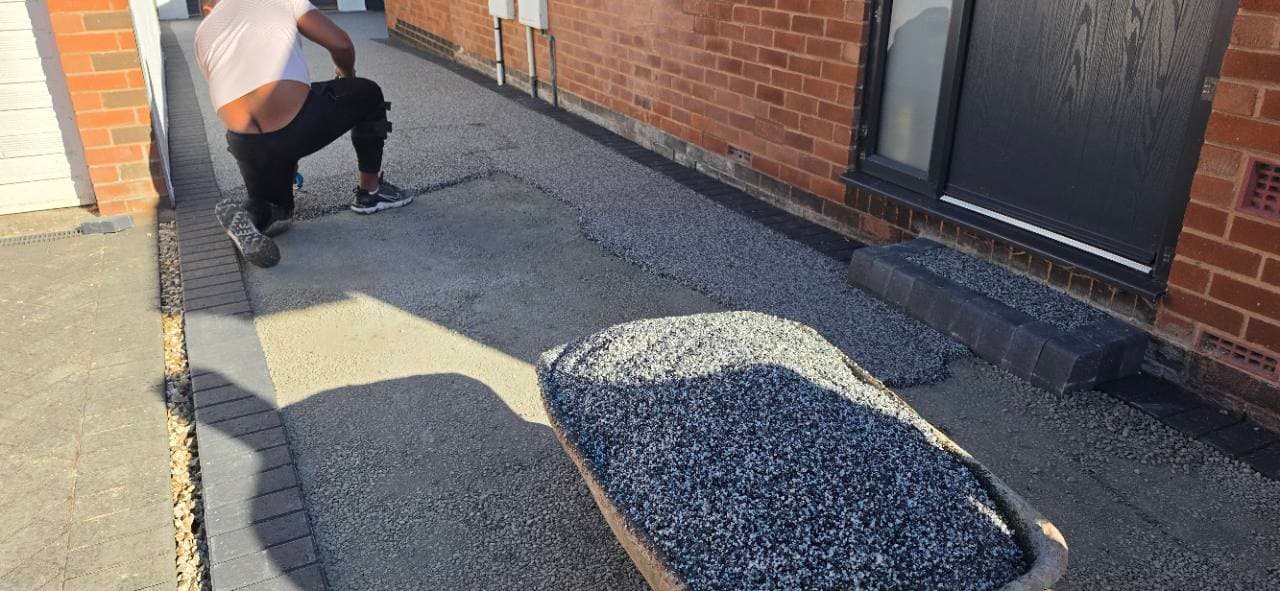 Palazzo resin bound aggregate being laid along the Exminster side driveway