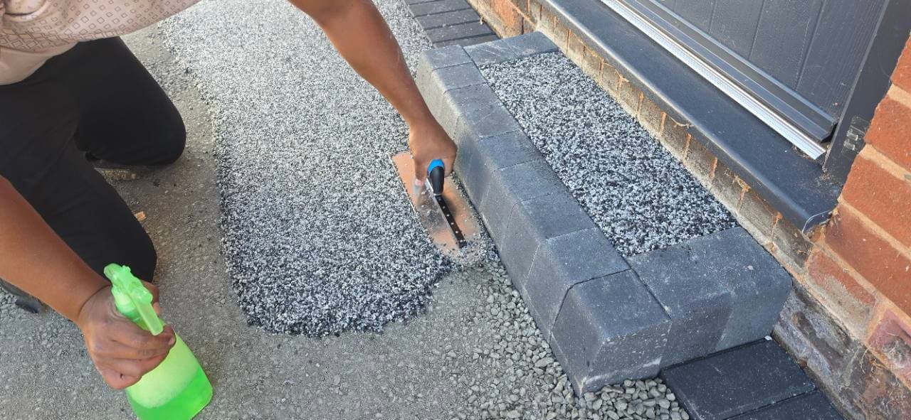 Resin bound surface hand finished around the new Exminster doorstep step