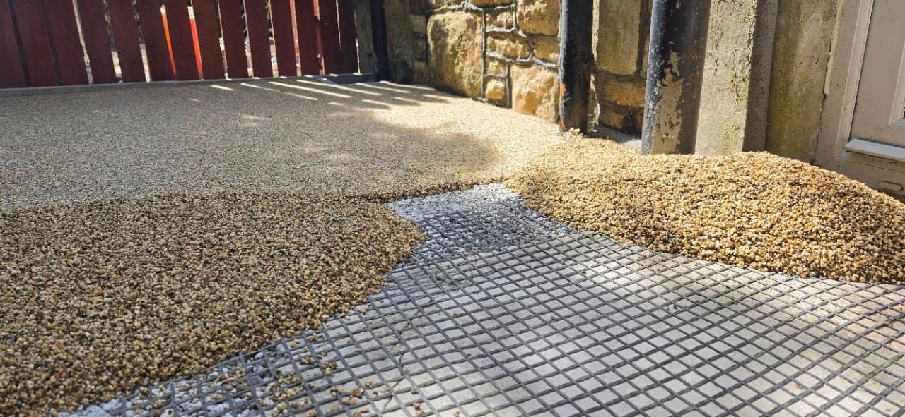 Canberra resin bound surfacing being laid over reinforcement mesh in Weston-super-Mare