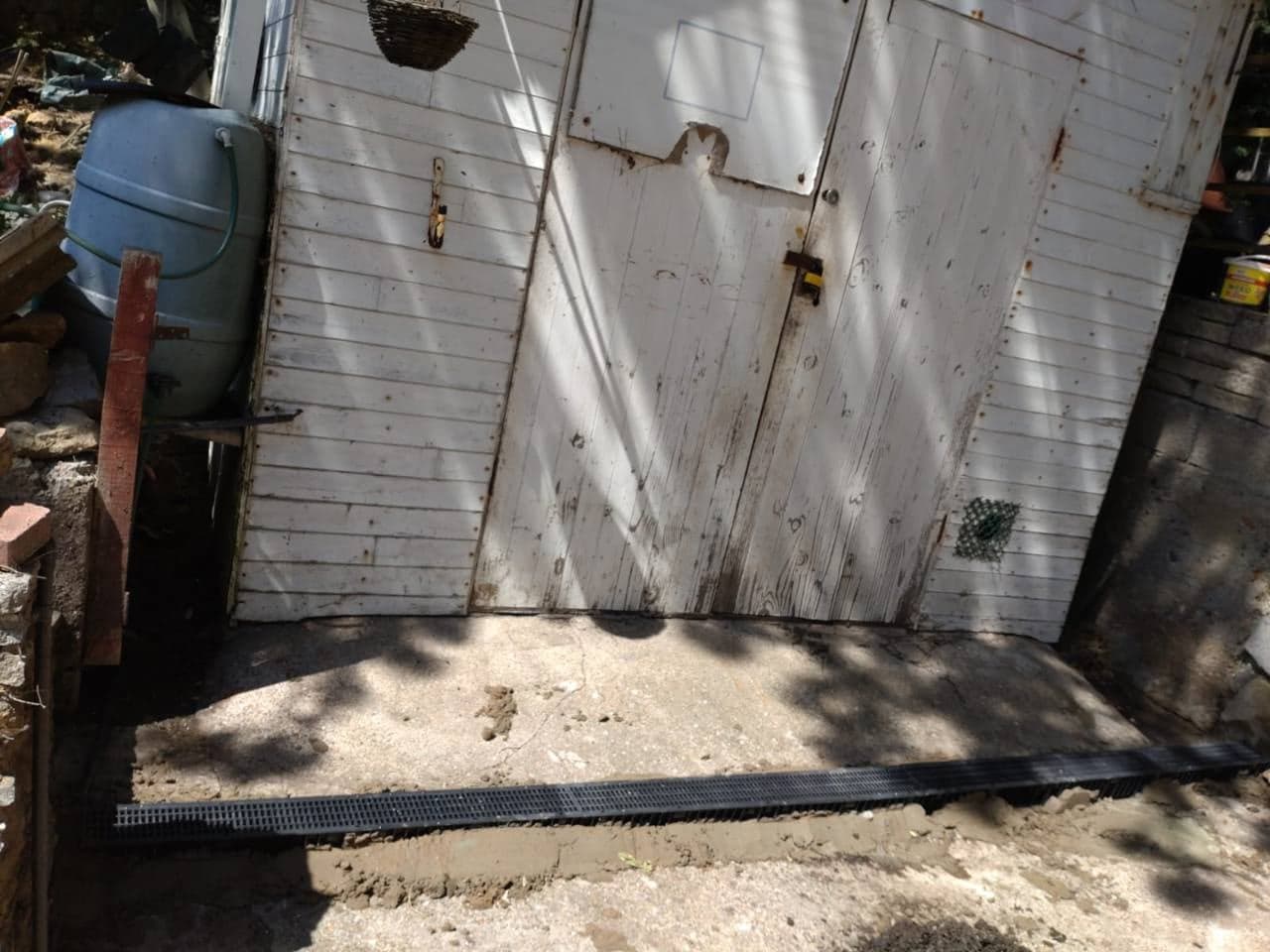 Channel drain installed across the Weston-super-Mare outbuilding frontage before surfacing
