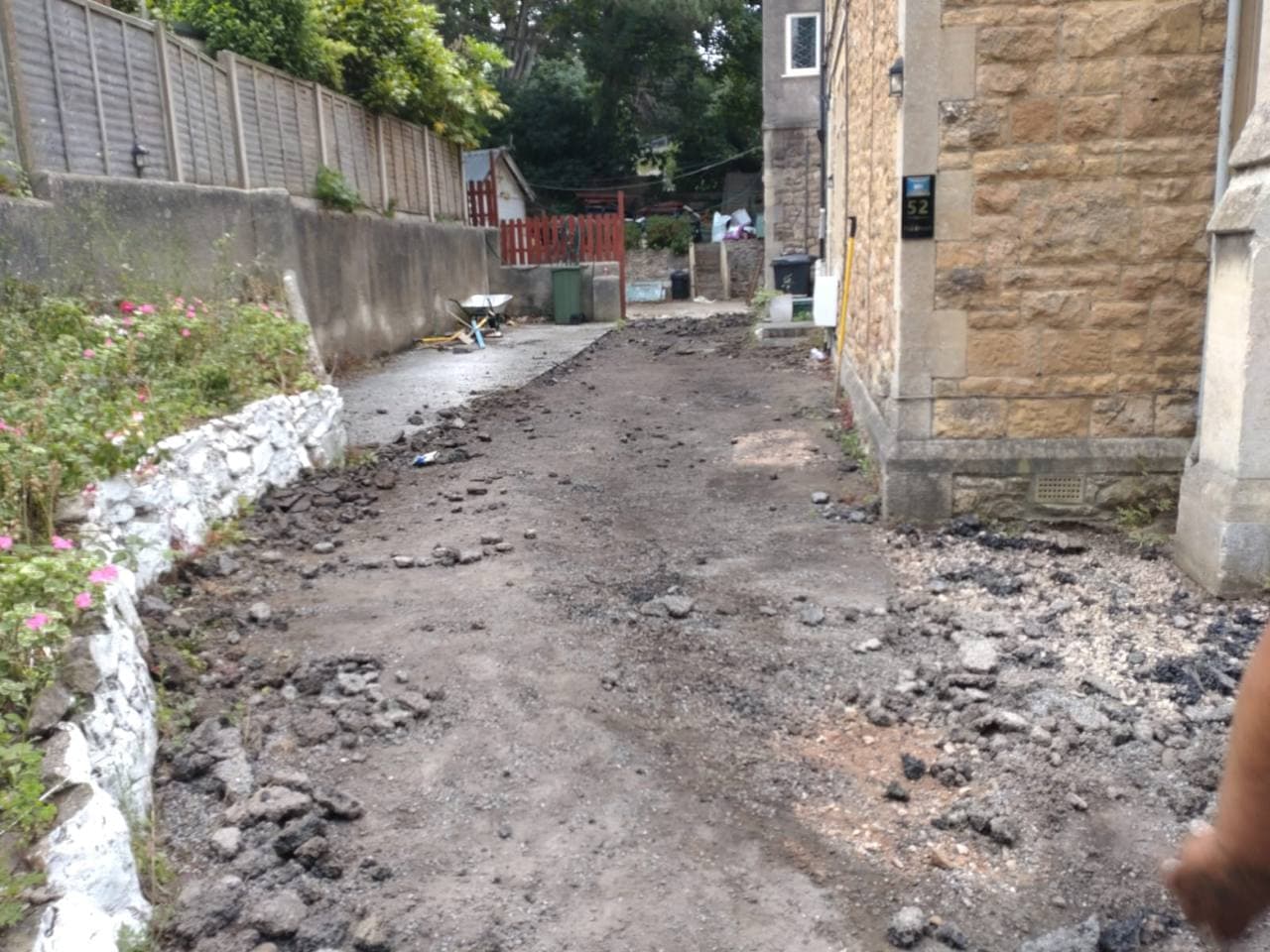 Old driveway surface being cleared during resin bound preparation in Weston-super-Mare
