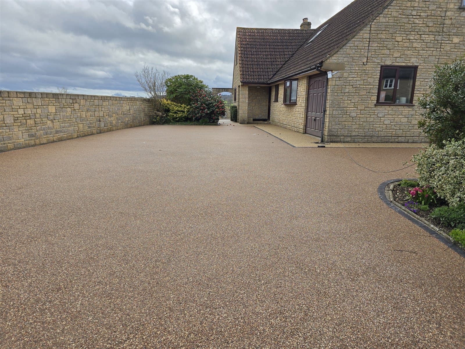 Resin bound driveway with stone edging detail