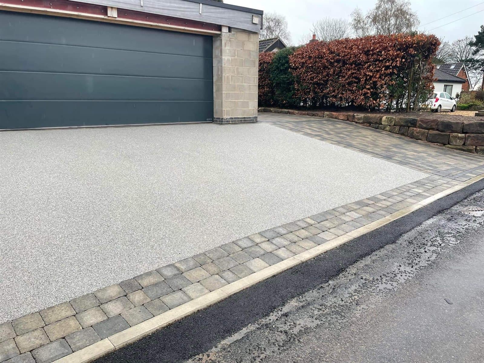 Silver resin bound driveway with block paved border