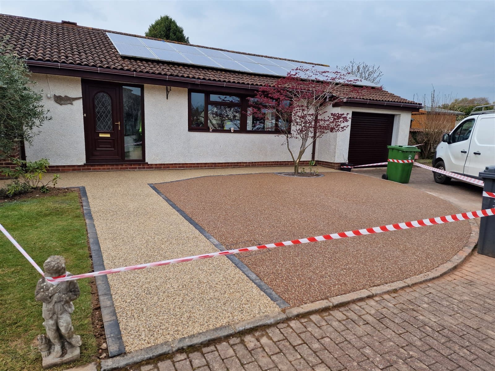Freshly laid golden resin bound driveway and pathways