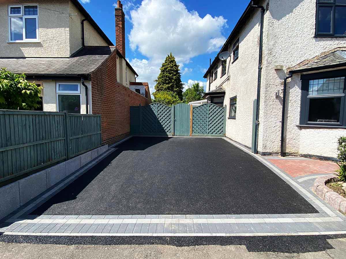 Tarmac driveway with light block paved borders