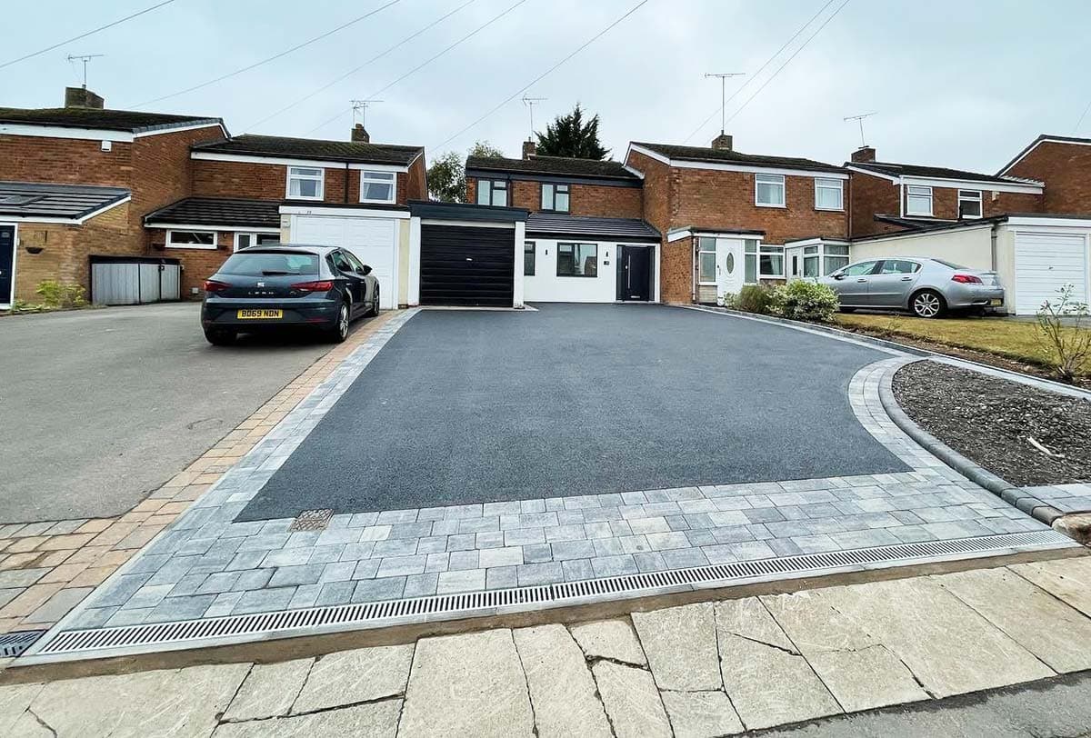 Tarmac driveway with block paved border and drainage channel