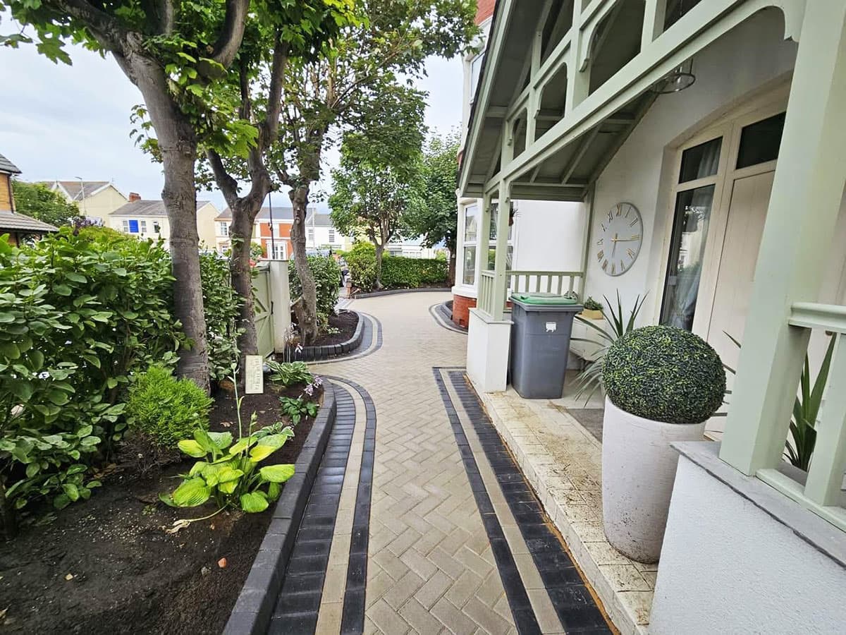 Block paved pathway with charcoal and cream banding