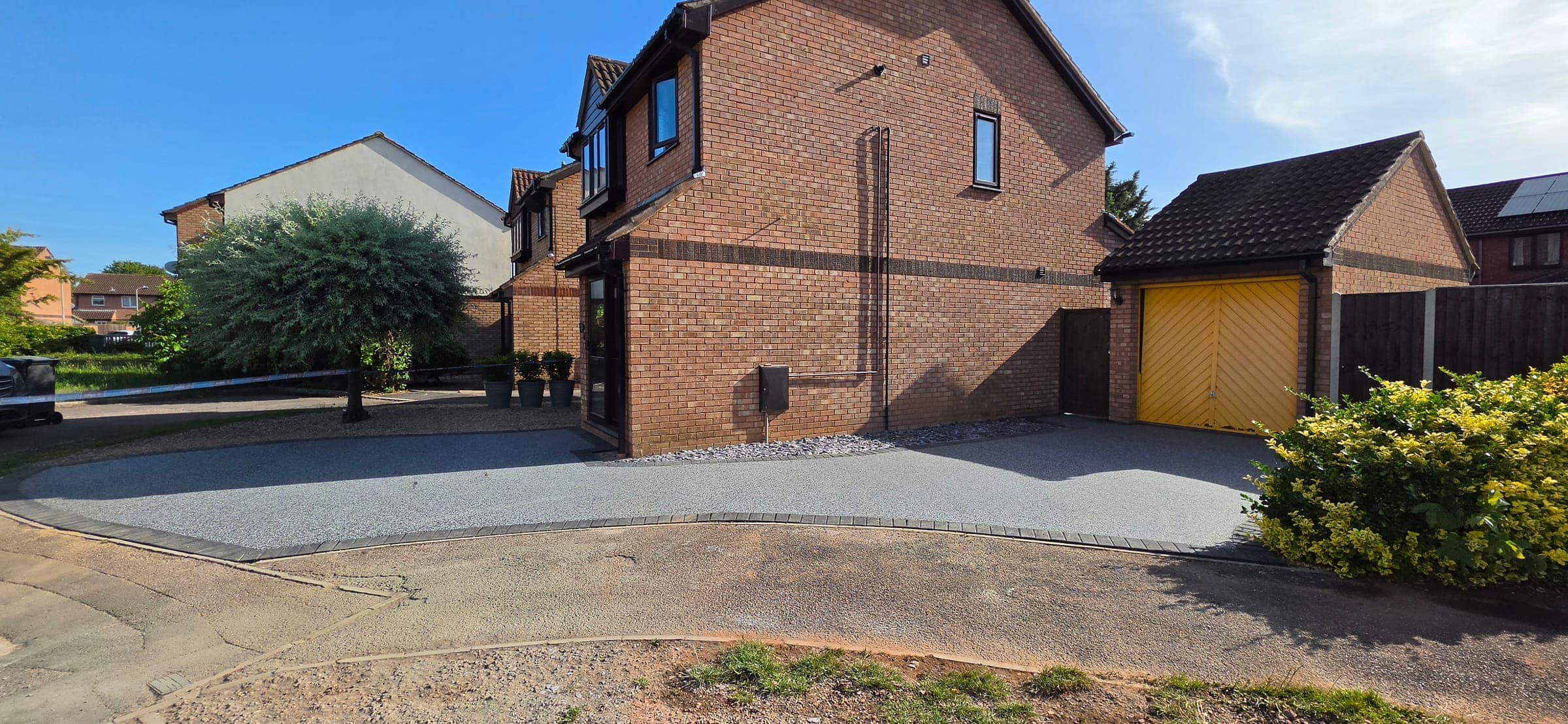 New Palazzo resin driveway with charcoal block border, Taunton