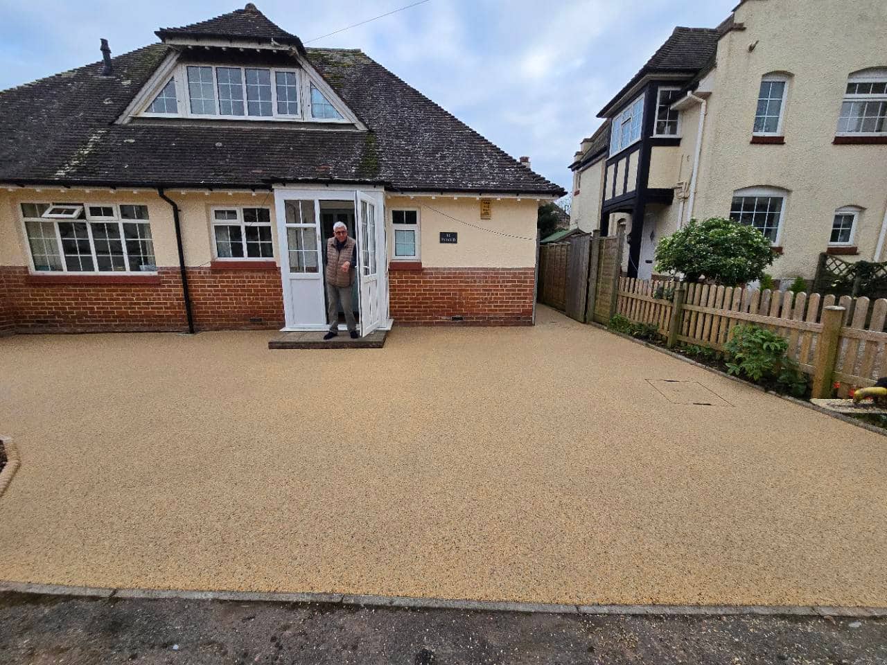 Completed Canberra resin bound driveway across a broad house frontage in Tiverton