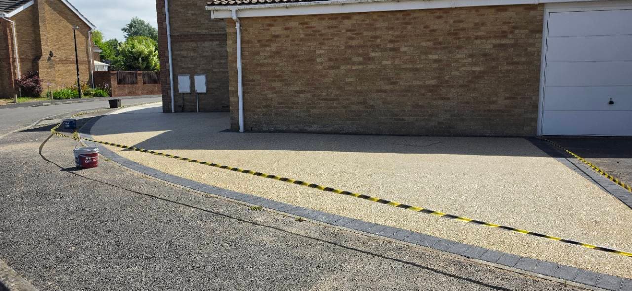 St Ives resin finish continuing across the garage frontage